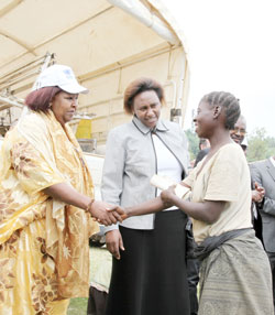 (L-R)Ms Neimah Warsame UNHCR Country Representative and Rose Makena Muchiri, Kenyan High Commissioner interact with a returnee. (Photo T. Kisambira)