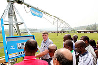 Theo Van Rensburg explaining to officials and farmers how the center Pivot works (Photo T.Kisambira)