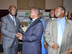  Labour Minister Anastase Murekezi interacts with participants during the workshop, yesterday. (Photo J Mbanda)