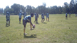 Brian Shema leads Apred Ndera in a warm up before the games (Courtesy photo)