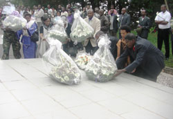 Denis Polisi (R) leads other mouners to lay wreaths at Bisesero Memorial Centre (photo S Nkurunziza)