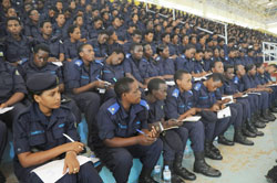 Female Police officers keenly listen to a presentation during a workshop at Amahoro stadium yesterday. (Photo J Mbanda)