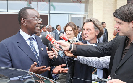 Premier Bernard Makuza speaking to journalists upon his arrival in Malabo yesterday. (PhotoT. Kisambira)