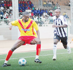 A St. George defender protects the ball against APRu2019s Mbuyu Twite during last yearu2019s friendly. APR lost 3-1 against the Ethiopians last evening. (File photo)