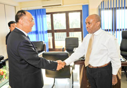  The New Times Managing Director, Joseph Bideri, welcomes Xinhuau2019s Wang Chaowen, at the publicationu2019s offices yesterday. (Photo Zhao Yingquan).