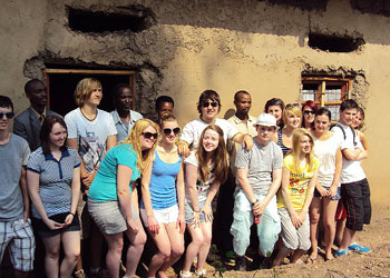 Scottish students pose for a photo with reconciled Genocide survivors and perpetrators.(Photo D.Sabiiti.J)