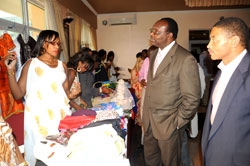 Trade and Industry Minister Francois Kanimba (2right), and SFB Rector Reid Whitlock, look at some of the products of Business Women. (Photo J Mbanda)