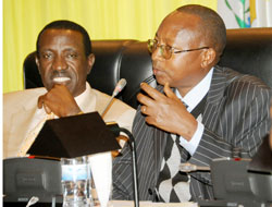 The Auditor General Obadiah Biraro (R) presents his report before Parliament. Gatsibo District officials have pledged to trace the missing funds. (Photo J Mbanda)