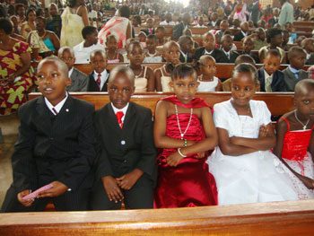 Gravis, Felix Mukono, Phiona Mukono and Benita Ibabaza at Regina Pacis church in Kimironko were cristened with other children.