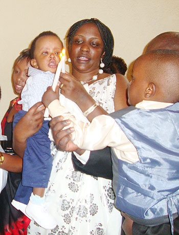 Frabrice Manzi with his mother at his baptism.