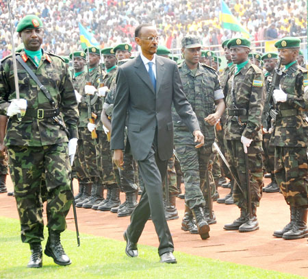 President Kagame inspects a guard of honour at the national celebrations to mark Liberation Day at Amahoro stadium, yesterday. (Photo J. Mbanda)