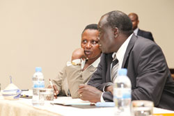 Justice Minister Tharcisse Karugarama (R) and Prisons, boss Mary Gahonzire during a recent commonwealth meet in Kigali. He will lead a delegation to Australia for another meeting