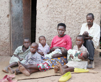 Theogene Murindabyuma(R) with wife and  their six children alongside his niece. There eldest daughter carries one of the Triplets (Photo T.Kisambira)