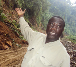 Patrice Nzamuye demonstrates one of the affected zones in the park. (Photo J P Bucyensenge)