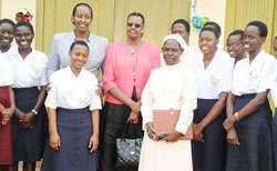  First Ladies, Mrs. Kagame (L) and Mrs. Museveni with Sister Seraphine, the headmistress of Namagunga girls and students from the school, yesterday.(Courtesy photo)