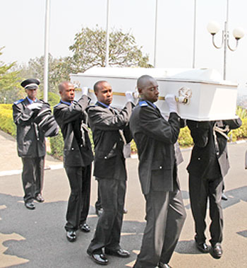 Policemen carrying a casket bearing the remains of the late MP Aimable Nibishaka to parliament (Photo T. Kisambira)