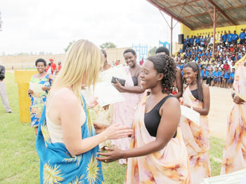 Women in Nyanza District receiving certificates during this yearu2019s International Womenu2019s day. They had successfully completed a course in Information Technology. (Photo D. Umutesi)