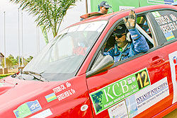Fitidis waves to the crowd after being flagged off during the 2009 KCB Rwanda Mountain Gorilla Rally. (File photo)