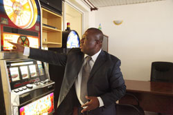 Phillip Brizoua explains how a slot machine works (Photo T.Kisambira)