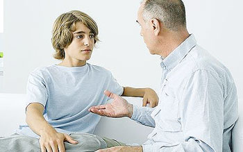 Teenager listening to his father 
