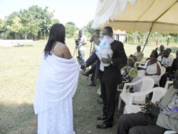 The First consular at the Rwanda High Commission in Uganda, Dan Mutezintare receives a basket from a member of Humura Association in Ggolo, Mpigi yesterday (Photo G Muramira).