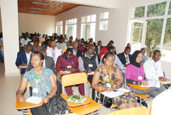 Students from the East African Community Students' Union take notes during the conference. (Courtesy photo)