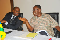 Prime Minister Bernard Makuza (R) chats with Local Government Minister James Musoni during the Local Government authoritiesu2019 performance contracts review yesterday. (Photo J Mbanda)