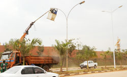 Kigali City Council employees mount streetlights in Kigali City. Kibungo authorities will spend a Rwf350 million to light up the town. (File photo)