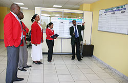 Brokers trade at the floor of the Rwanda Stock Exchange . File Photo