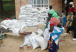  Food items being distributed at a transit camp. WFP has warned of a food crisis if it fails to get funds. The New Times File
