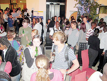 Guests enjoy a cocktail after the premiere. The New Times / John Mbanda