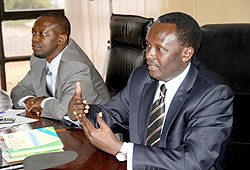 Martin Ngoga (R) and his deputy Alphonse Hitiyaremye during the press conference at MINIJUST yesterday. The New Times John Mbanda.