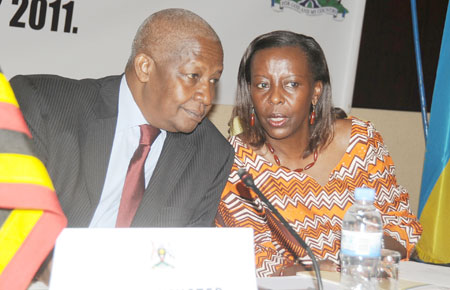  Foreign Ministers, Sam Kutesa of Uganda (L) and Louise Mushikiwabo of Rwanda consult during the 9th JPC yesterday. The New Times/ John Mbanda.