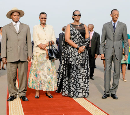 President Kagame (R) and the First Lady, Mrs Jeannette Kagame (2nd R), treated the Ugandan President, Yoweri Museveni and his wife Janet Museveni, to a red carpet welcome at the Kigali International Airport, yesterday. The New Times/Village Urugwiro.