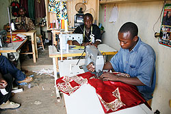 Tailors in one of many Kigali shops. Rwanda has been hailed for ratifying Labour conventions. The New Times File.
