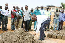 Officials participate in building of classes during the Nine Year Basic Education a couple of years ago. The 12YBE will be launched today. The New Times File.