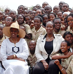First Ladies Jeannette Kagame (R) and her Ugandan counterpart, Janet Museveni, in a group photo with some of the students taking part in Itorero at Gako, yesterday. The New Times /Courtesy.