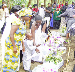 A family lays a wreath at the memorial centre shortly after the burial. The New Times /Sam Nkurunziza