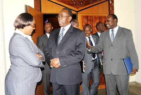 Prime Minister Bernard Makuza  (C) talks to the Speaker of the Lower chamber, Rose Mukantabana, yesterday at Parliament buildings. The New Times John Mbanda