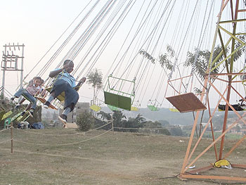 Children enjoy at the rotating swing. 