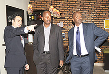 The CEO of the National Aviation Services (NAS) Hassan  El-Houry (L) shows the Minister of Infrastructure Albert Nsengiyumva around the newly opened VIP Lounge as Civil Aviation Authority Chief Richard Masozera looks on.The New Times /John Mbanda.