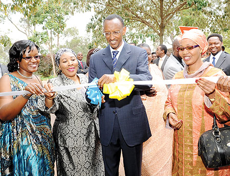 President Kagame cuts the ribbon to officially open an EAC women entrepreneurs exhibition on the sidelines of the first ever EAC Women in Business Conference yesterday. The New Times/ Village Urugwiro