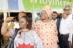  Serafina Mukantabana (2nd Right) who voluntarily returned from Congo Brazzaville along with relatives and friends on arrival at the airport yesterday. The New Times John Mbanda