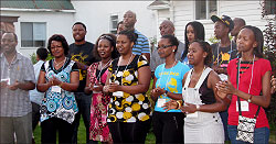 Rwanda's High Commissioner to Canada, Eddah Mukabagwiza (2nd left), joins the youths in a morale boosting session after the opening of Itorero in Gatineau, Canada. Courtesy Photo.