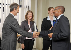 Finance Minister John Rwangombwa (R) shakes hands with  the German Embassy charge d'Affaires Wolfgang Wiesner as KFW Director in Kigali Dr. Daniela Beckmann (2nd right) and Andrea Hensel, a development consular with the German Embassy look on. The New Tim