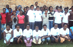 A cross section of the teenage girls and their trainers pose for a group photo. The New Times/Steven Rwembeho