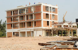 The former Post Office headquarters at the initial stages of demolition. The property will be soon offered to capable developers. The New Times /John Mbanda