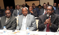 BK Managing Director James Gatera (R) speaks at the monetary policy statement meeting as his counterparts Jack Kayonga (C) of BRD and Geoffrey Byegeka of CSS look on. The New Times /John Mbanda. 