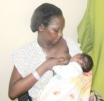 A woman breast feeds her baby at King Faisal Hospital. The New Times