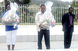 Olyvia Imalwa, APA President  and Richard Buteera, Director Public Prosecution of Uganda laying wreath as Martin Ngoga looks on. The New Times Bosco Asiimwe.